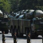 Military vehicles carrying DF-21D missiles are displayed in a military parade at Tiananmen Square in Beijing on Sept. 3, 2015.